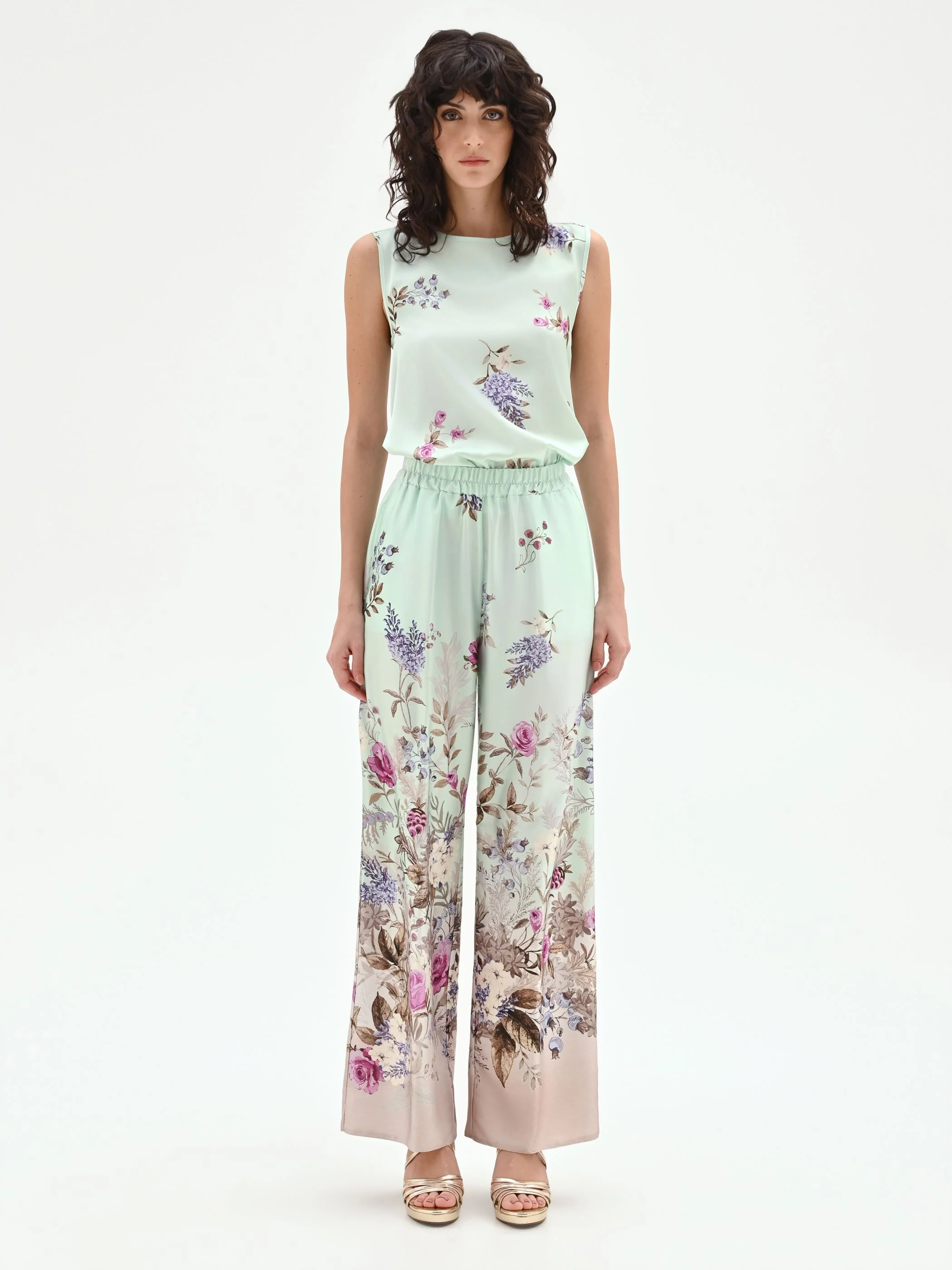 Pantalone palazzo verde menta in raso con stampa botanica