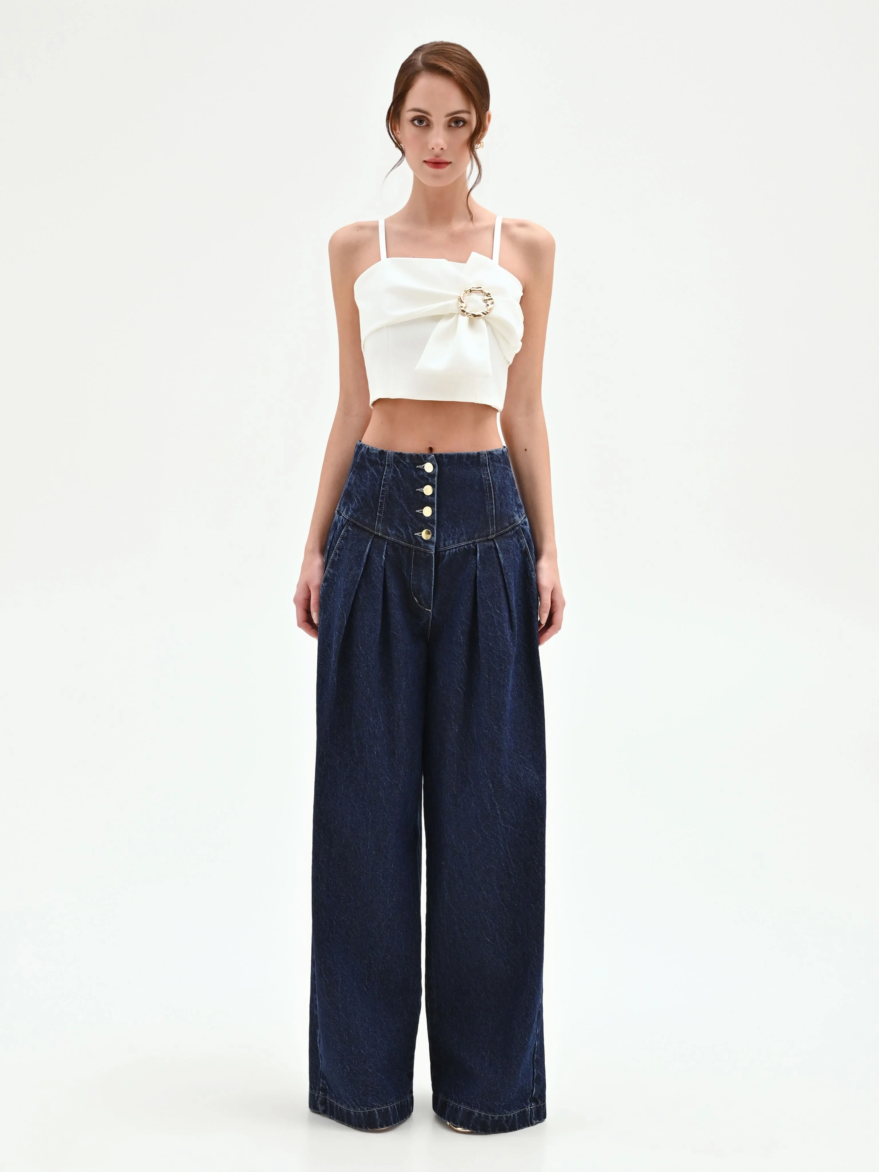 Top crop panna con maxi fiocco