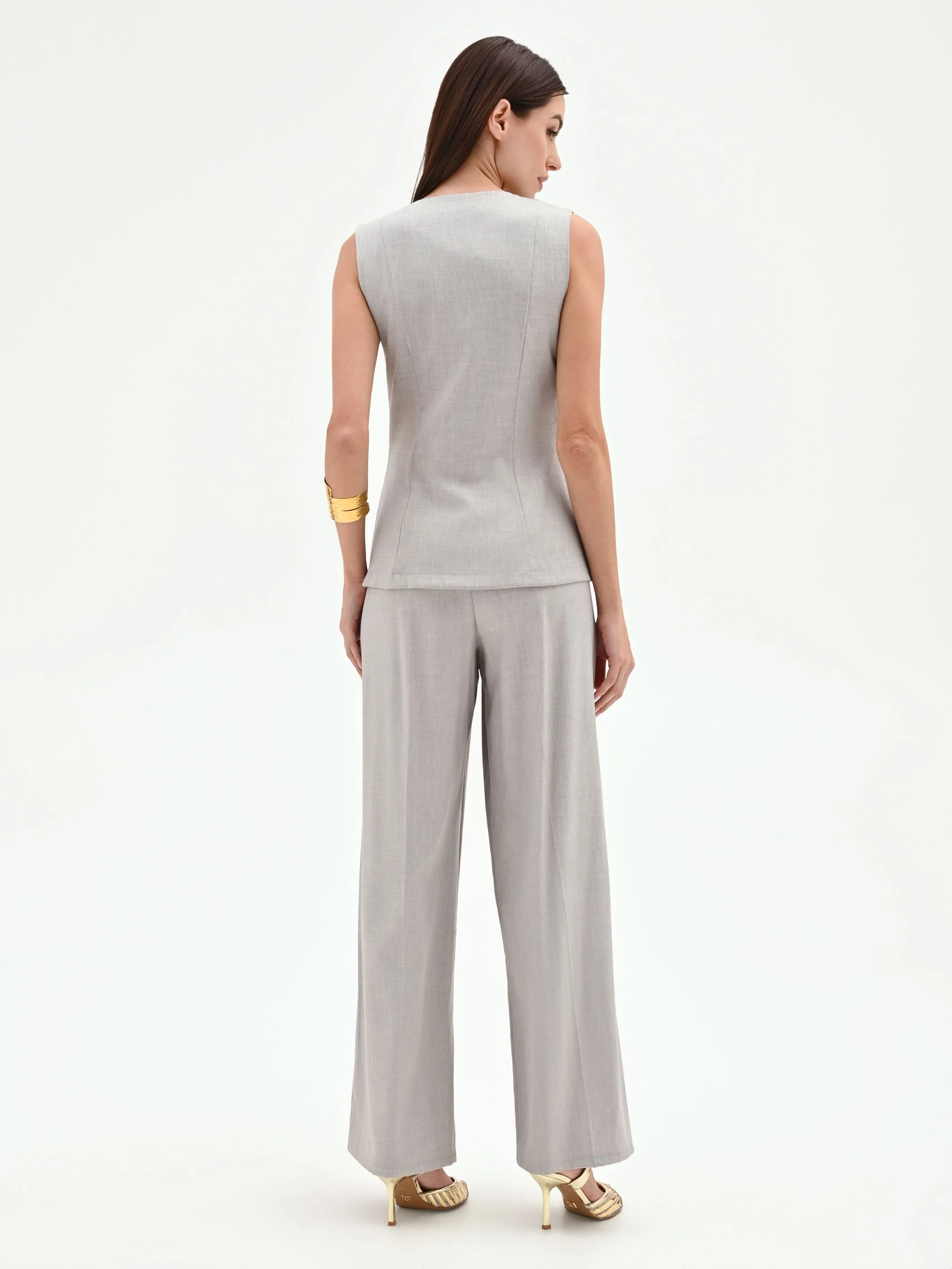 Tuta grigia con gilet e pantaloni palazzo - Image 3