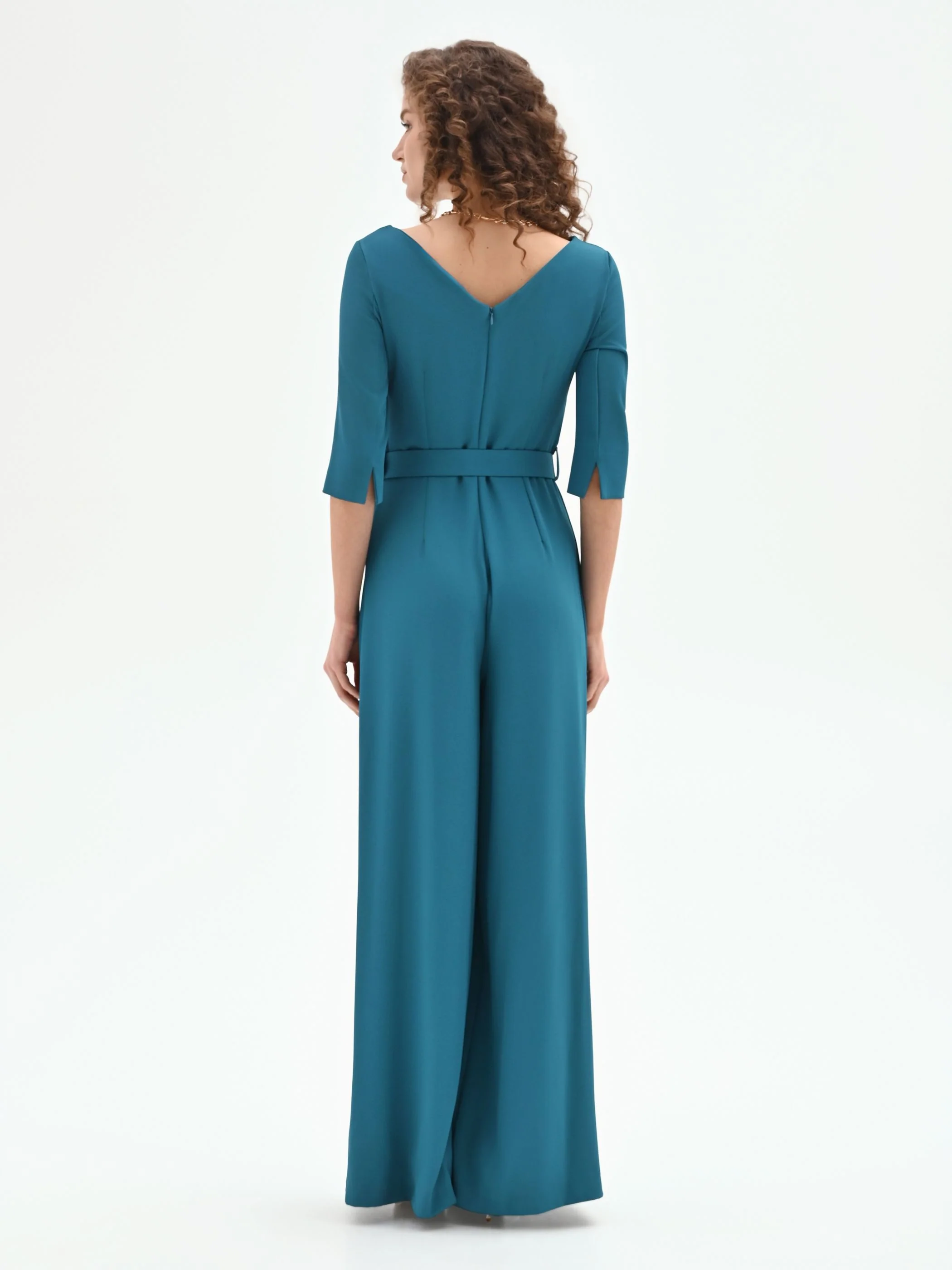 Tuta verde ottanio con scollo drappeggiato